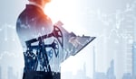 Businessman with clipboard and pumpjack_ImageFlow