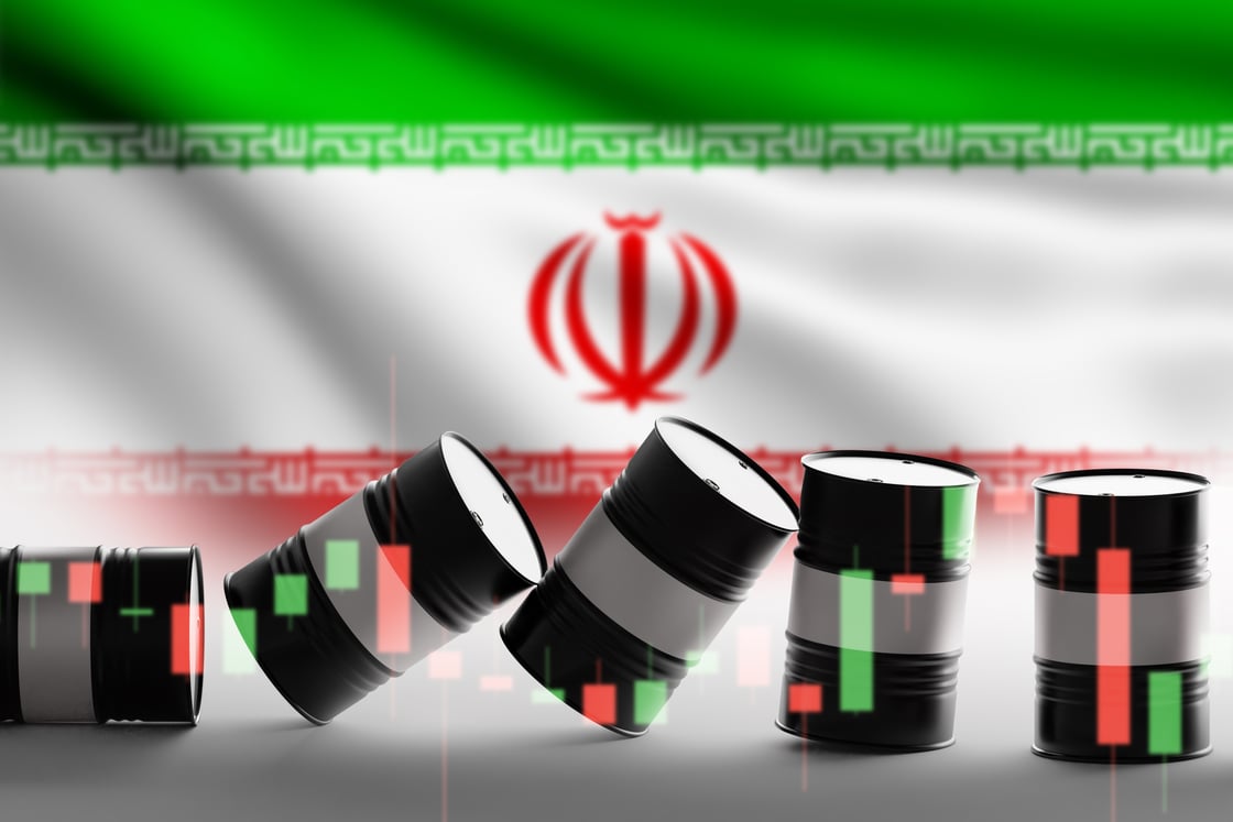 Iran flag and oil barrels_FotoGrin