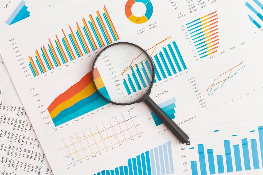 graphs and magnifying glass