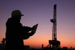 oil rig with worker and computer_junrong